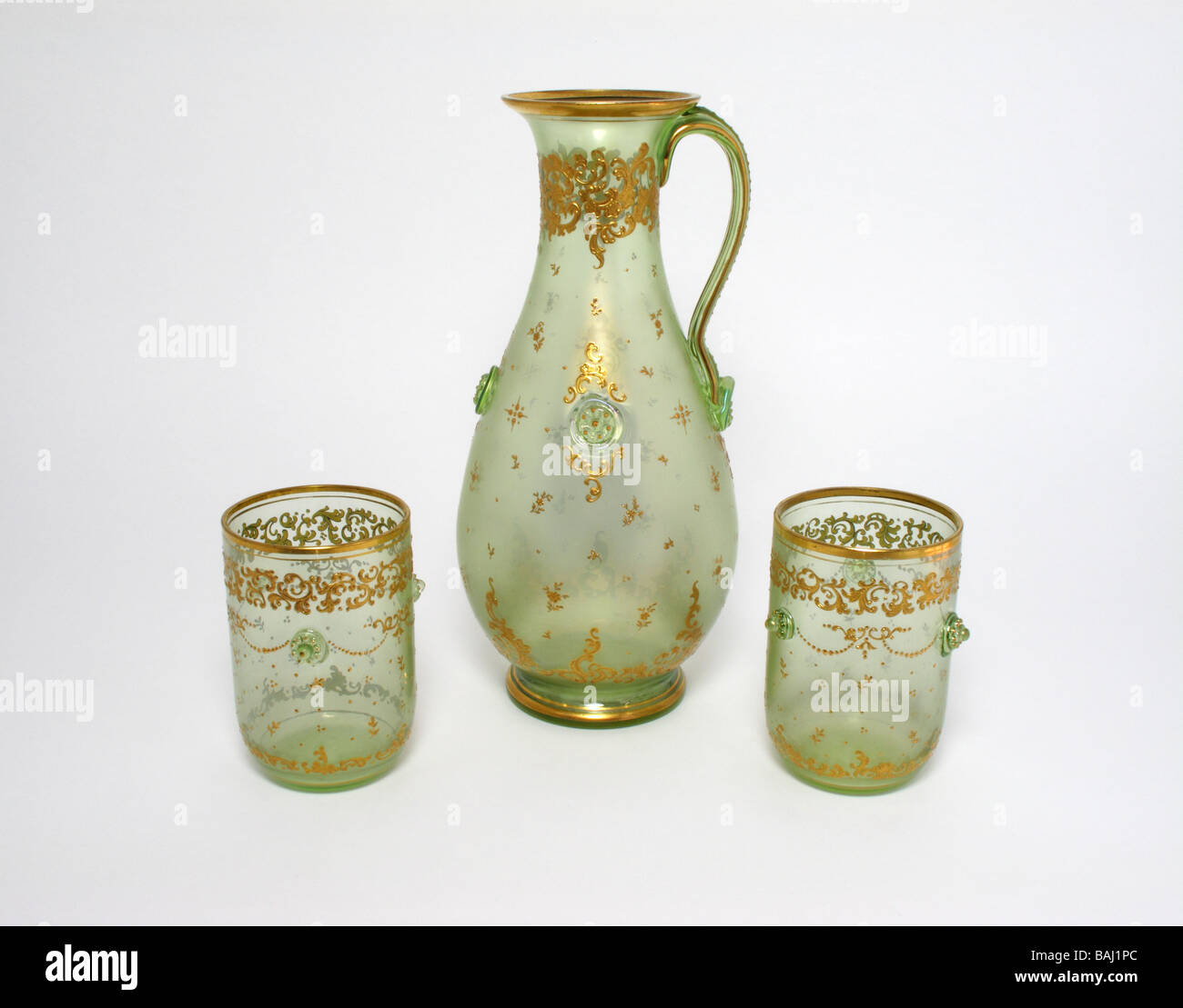 Antique iridescent glass jug and two beakers circa 1890 Stock Photo