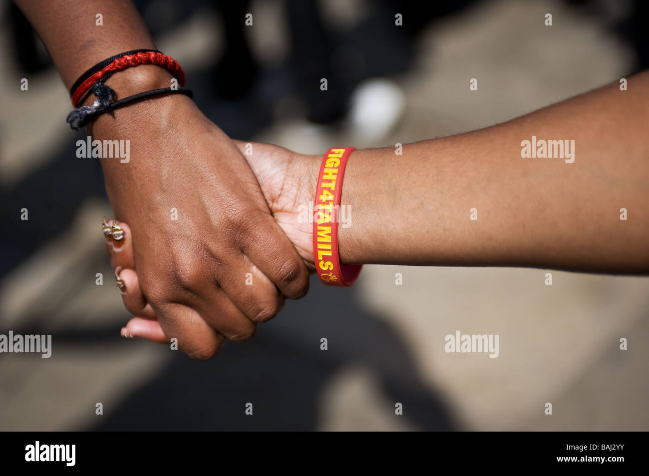 Students holding hands at the Tamil demonstration protest in London. Stock Photo