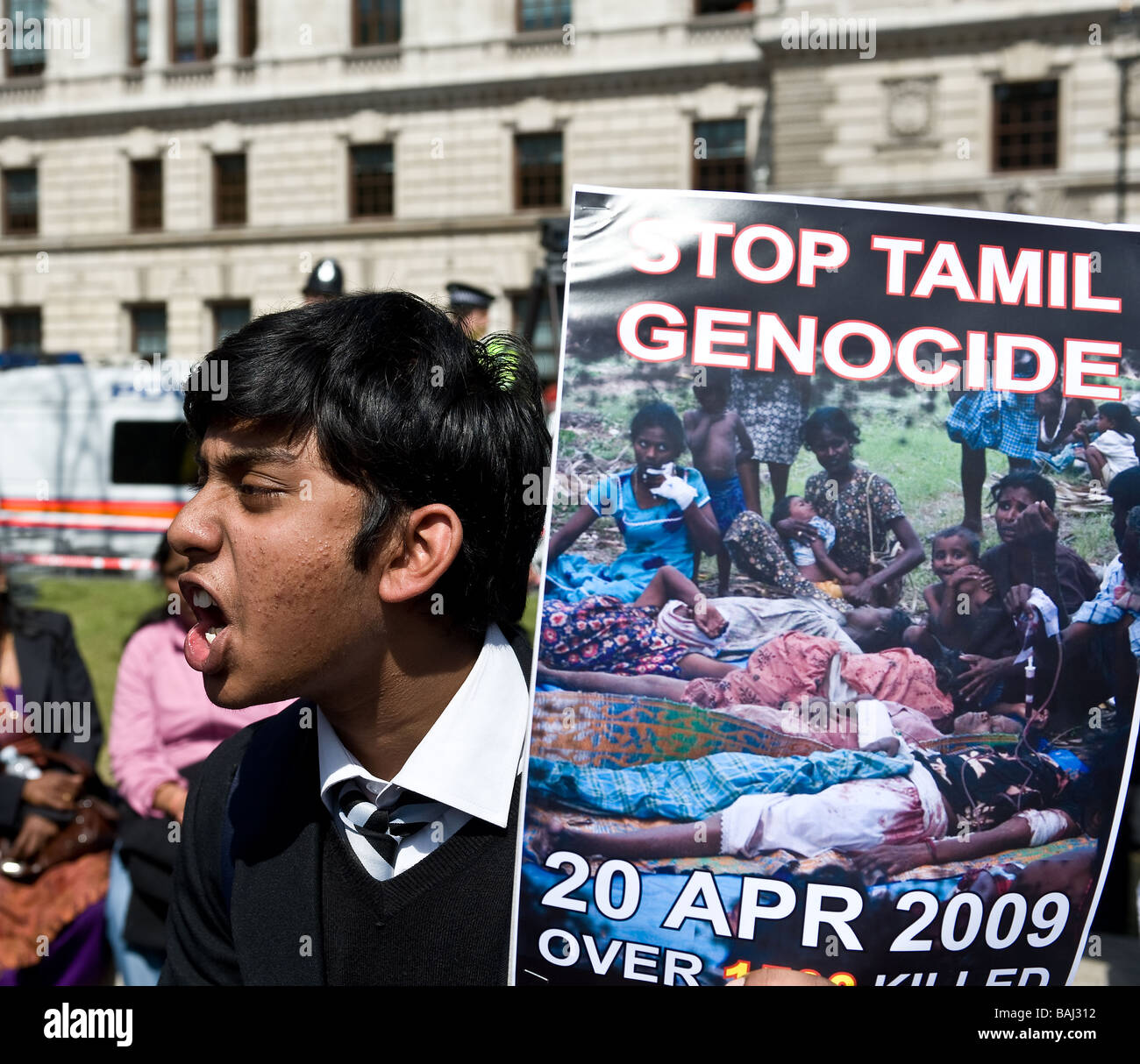 A student shouting and holding a placard at the Tamil demonstration in London.  Photo by Gordon Scammell Stock Photo