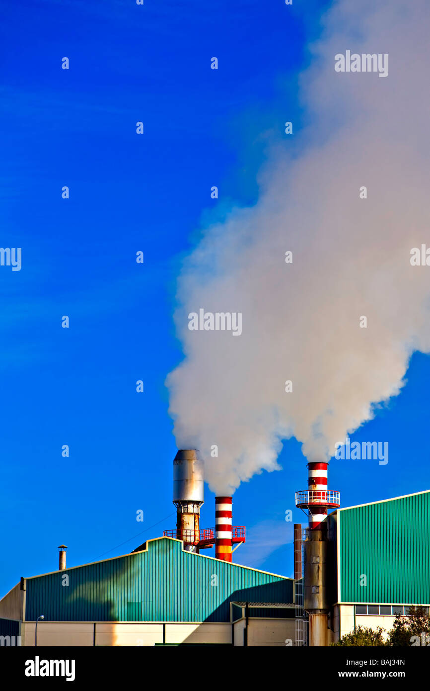 Industry/Smoke stacks creating air pollution in the town of Baeza,Province of Jaen,Andalusia (Andalucia),Spain,Europe. Stock Photo