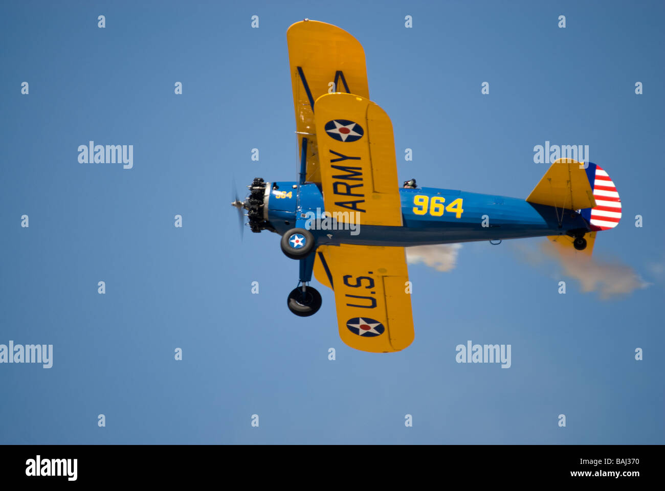 A US Army version of the Stearman biplane - in flight and seen from an underneath angle Stock Photo