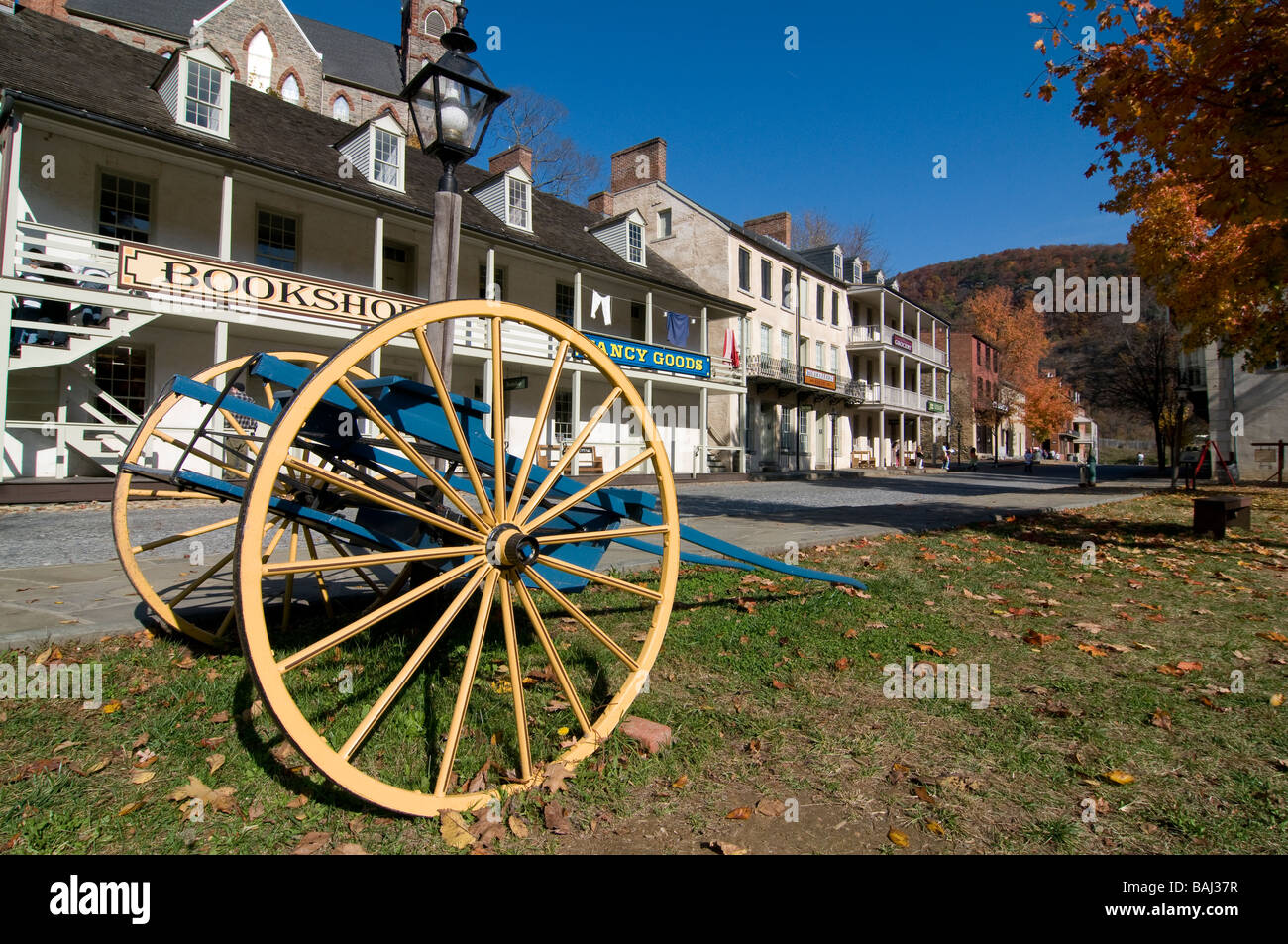 Old carrier before the little houses in Harpers Ferry sourrounded by