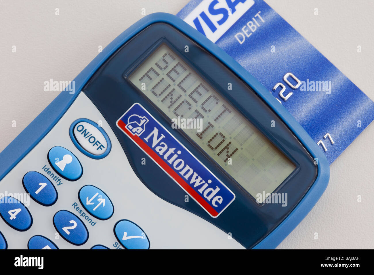 Close up of Nationwide bank card reader with Visa debit card inserted for secure online transactions and payment with internet banking. UK Stock Photo