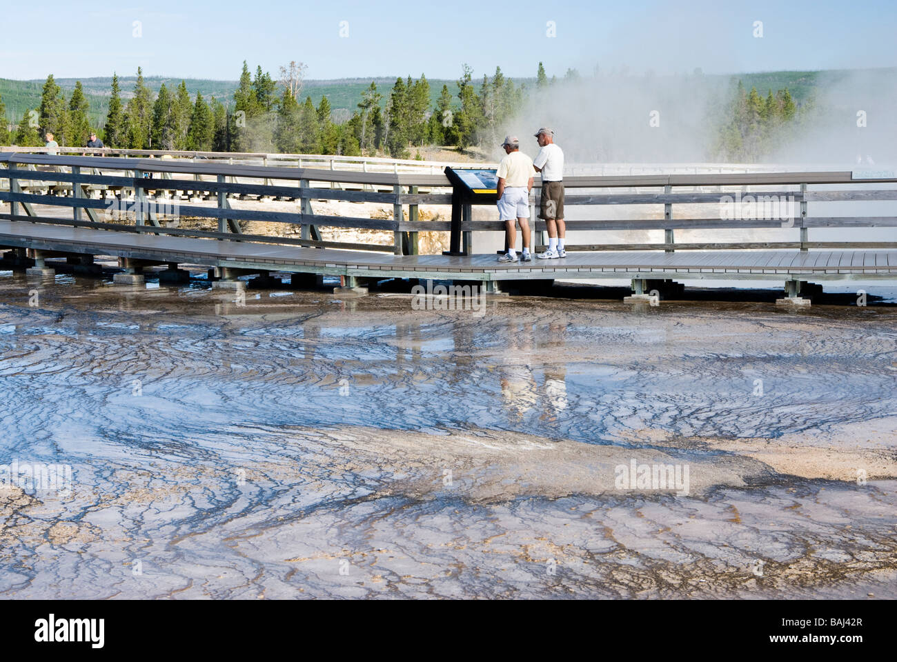 tourists at Midway Geyser Basin in Yellowstone National Park Stock Photo