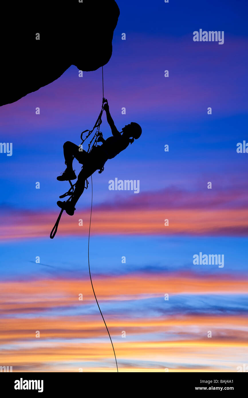 Rock climber rappelling Stock Photo Alamy