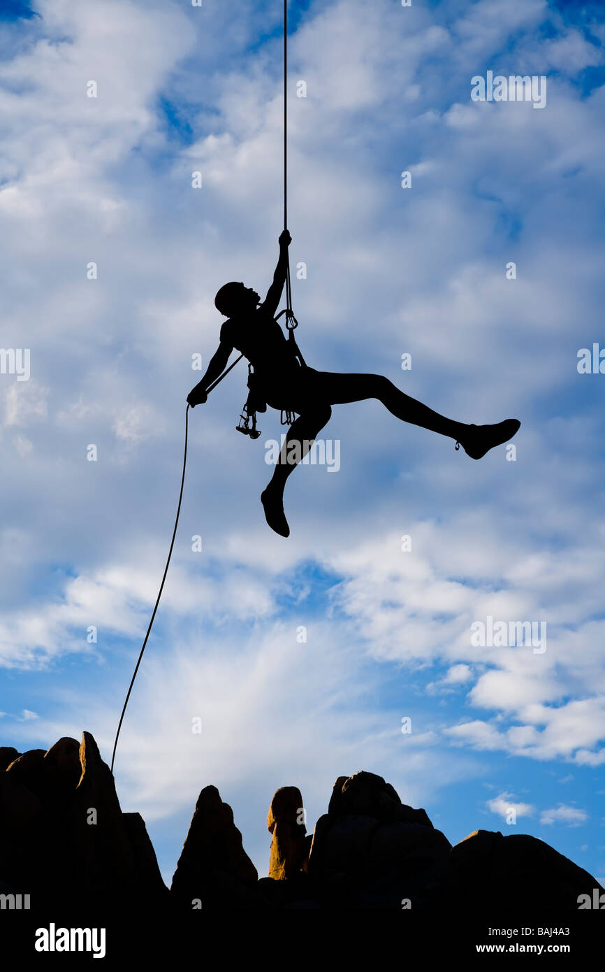 Rock climber rappelling Stock Photo Alamy