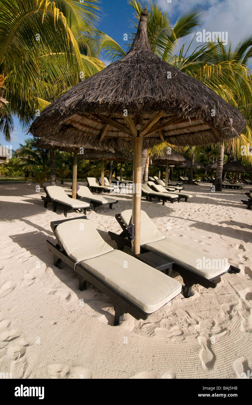 Calm place under sunshade at sand beach of Le Paradis hotel Mauritius Africa Stock Photo