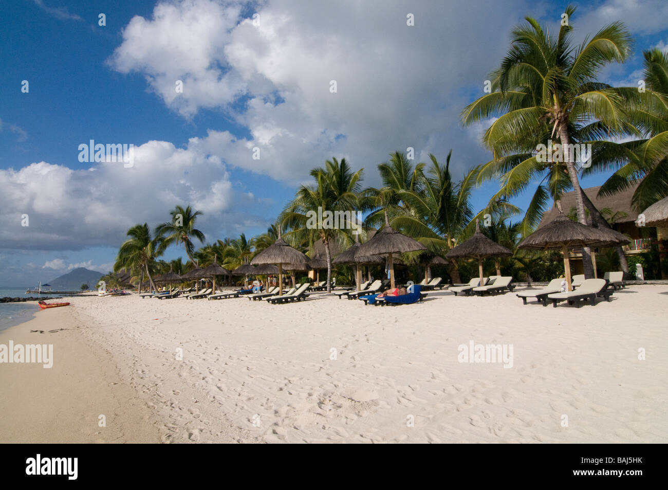Wonderful bright sand beach with palm Le Paradis hotel Mauritius Africa Stock Photo