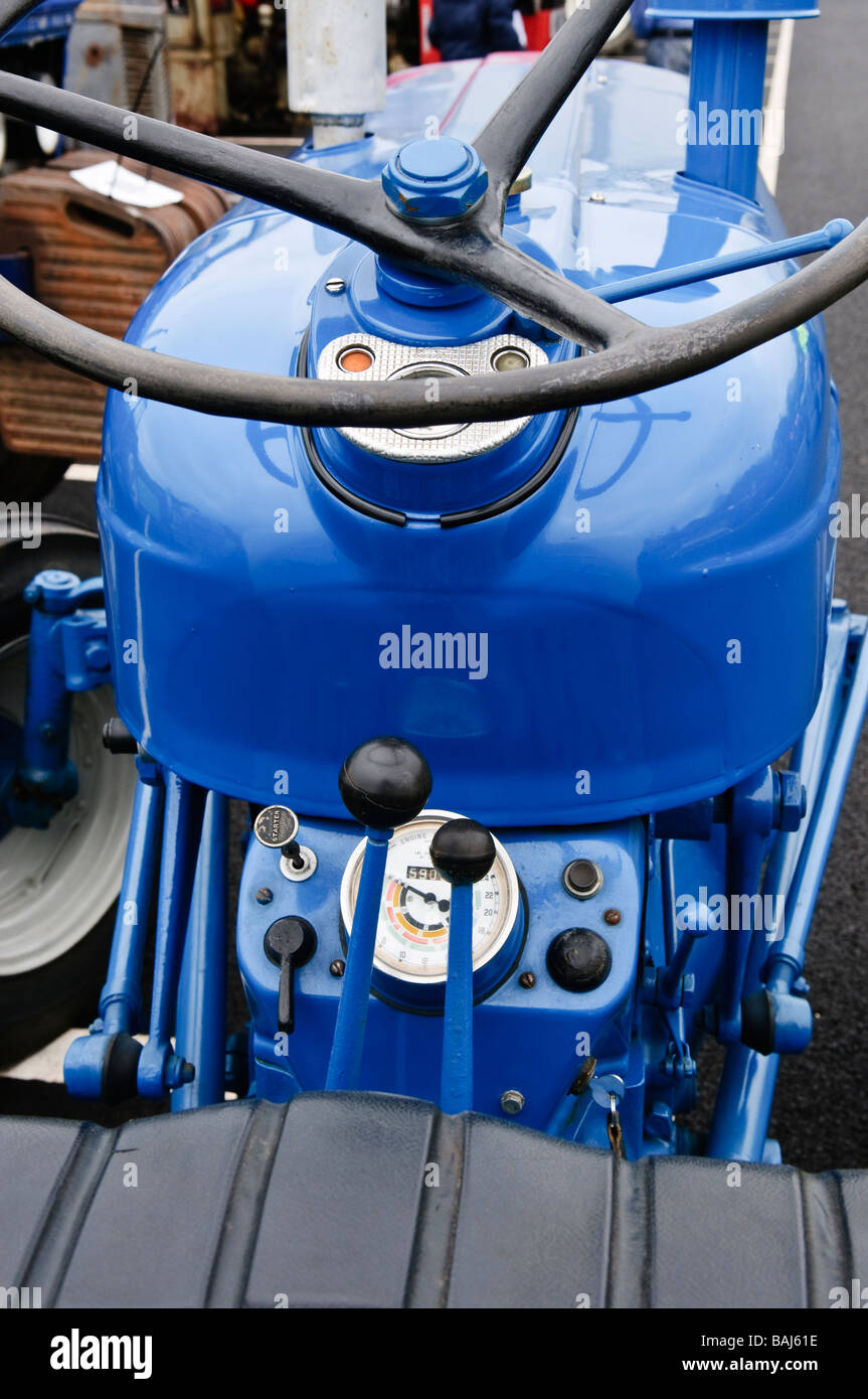 Steering wheel, gear stick, ratio selector and speedometer on a blue