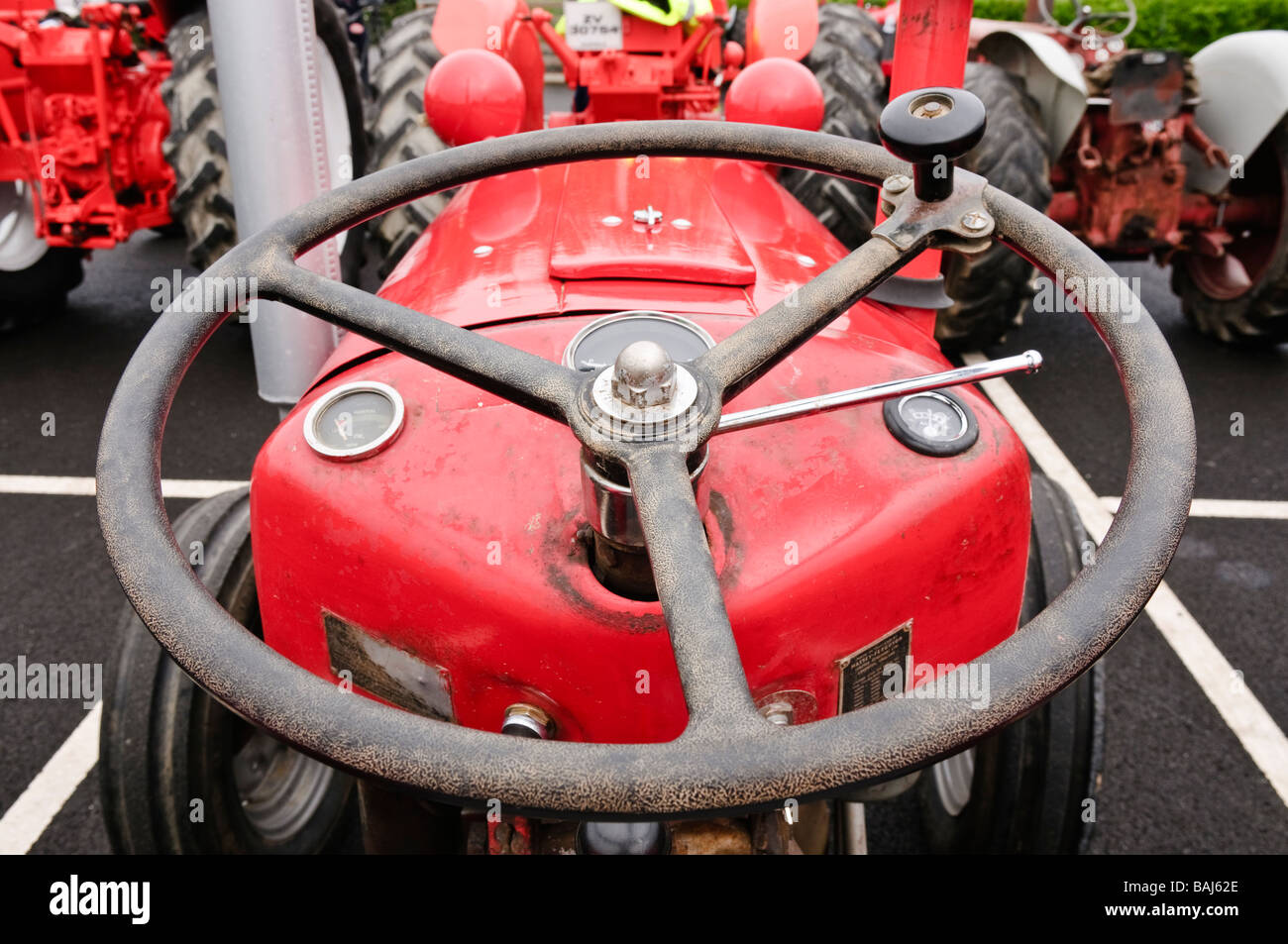 Steering wheel on a red vintage farm tractor Stock Photo Alamy
