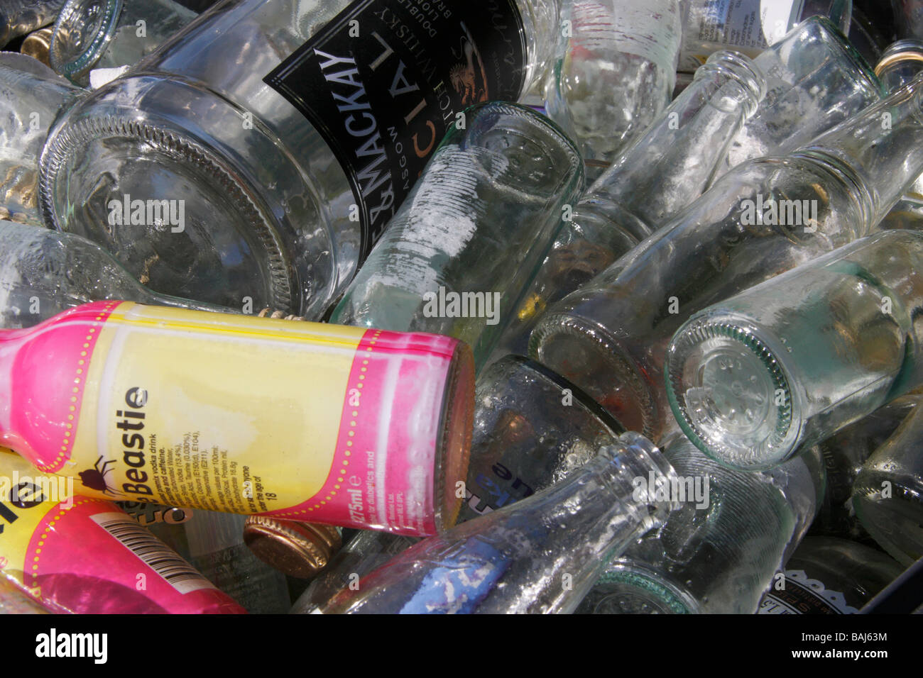 Glass bottles in bin for recycling Stock Photo Alamy