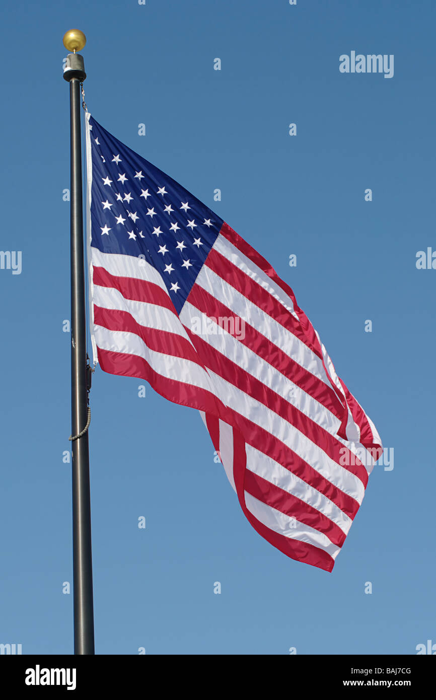 American flag against blue sky Stock Photo - Alamy