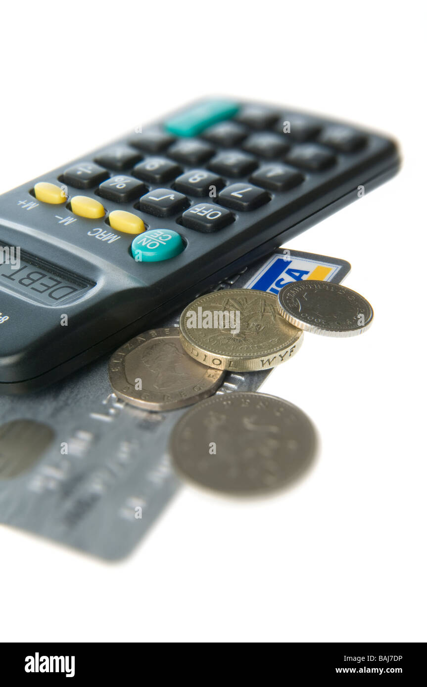 credit card with calculator and coins Stock Photo