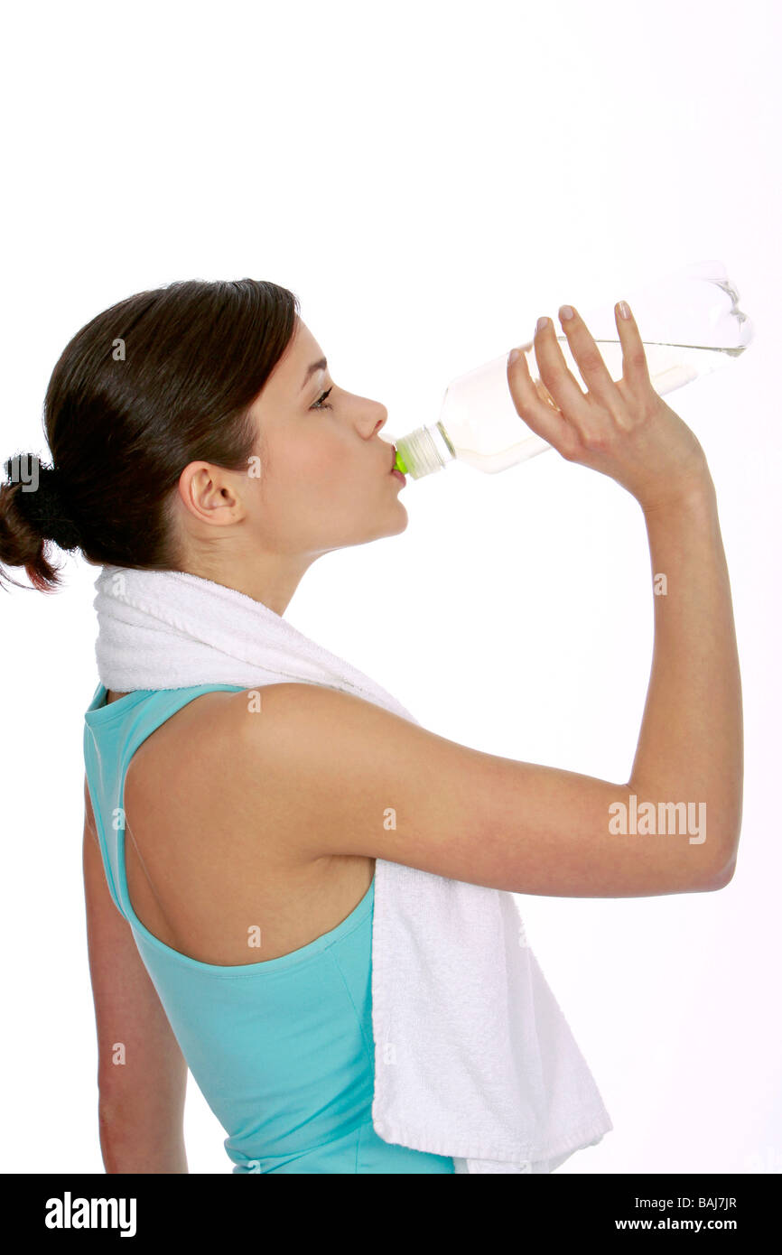 junge Frau in Sportdress mit Wasserflasche, woman drinking water Stock Photo