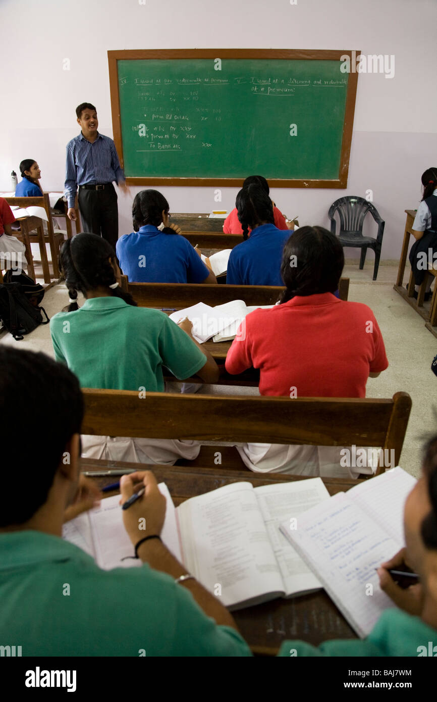 Teacher teaching his class at a school in Hazira, near Surat. Gujarat. India. Stock Photo