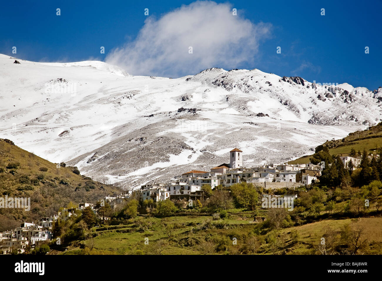 Capileira and Sierra Nevada Barranco del Poqueira in Las Alpujarras Granada Andalusia Spain Stock Photo