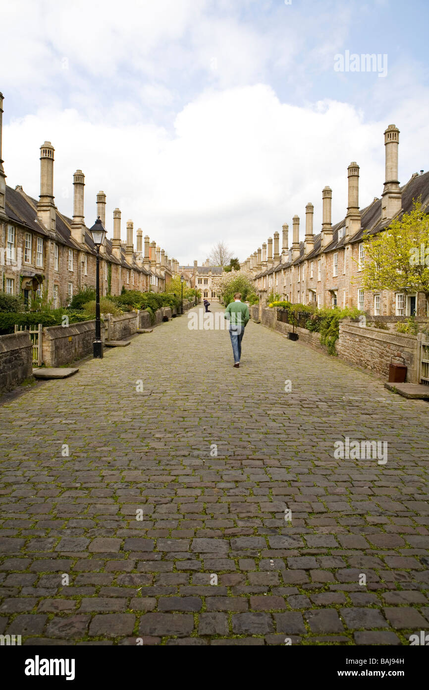 Rows of cottages with distinctive tall chimneys at Vicars Walk in Wells in Somerset Stock Photo