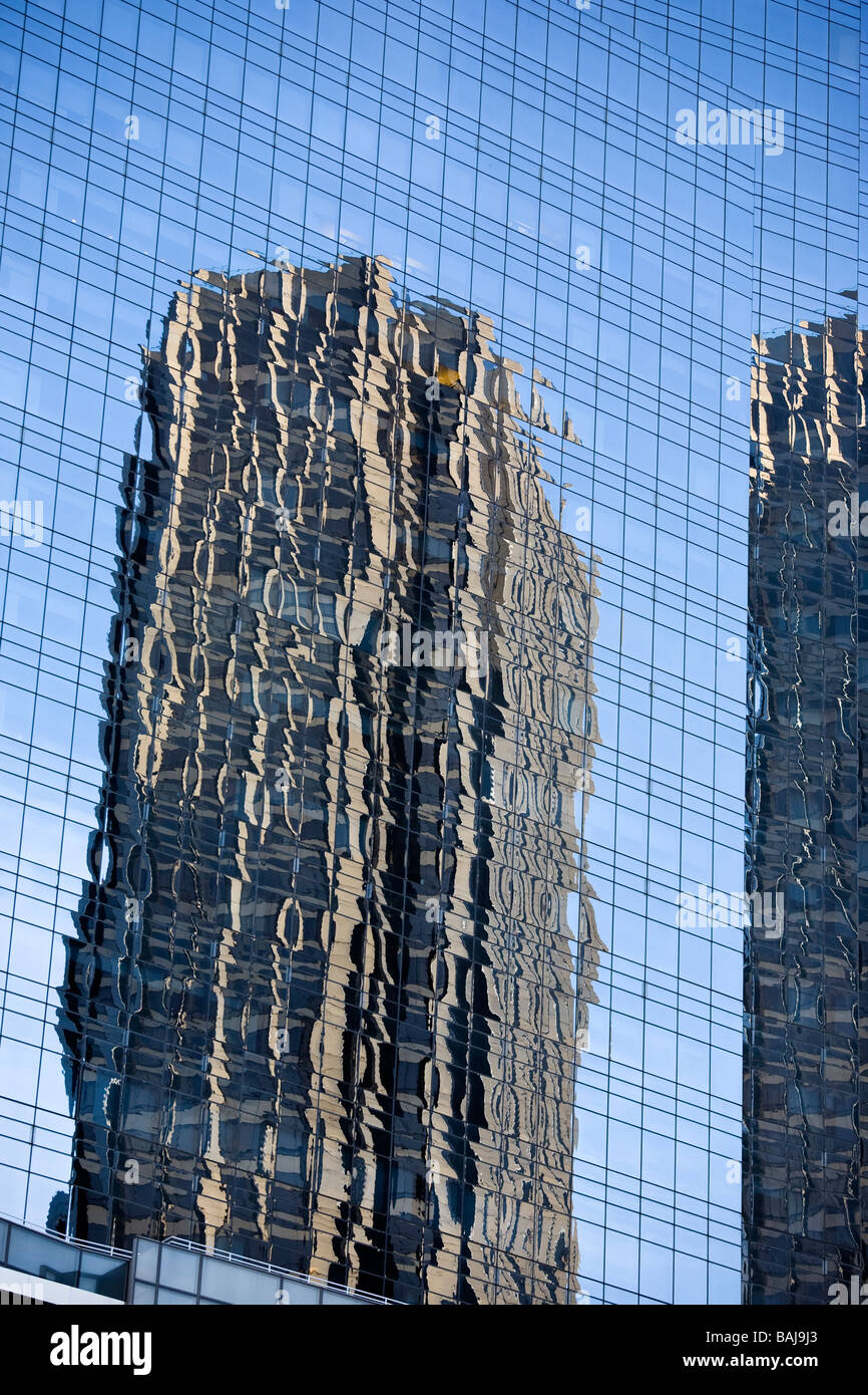 Reflection of the Donald Trump International Hotel in the glass windows of an office skyscraper near to Central Park New York US Stock Photo