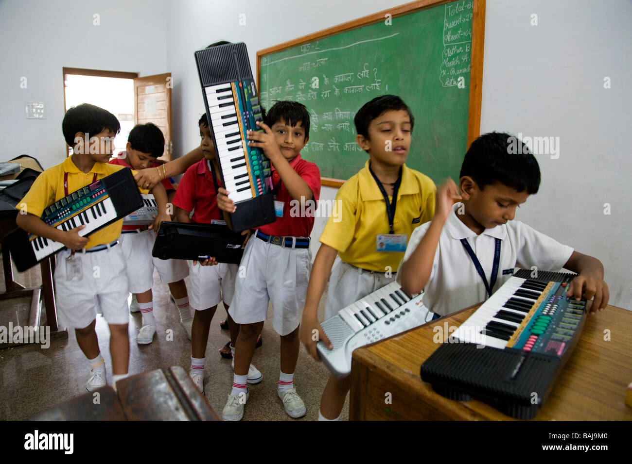 Children / kid / kids in a music class at school in Hazira, near Surat.  Gujarat. India Stock Photo - Alamy