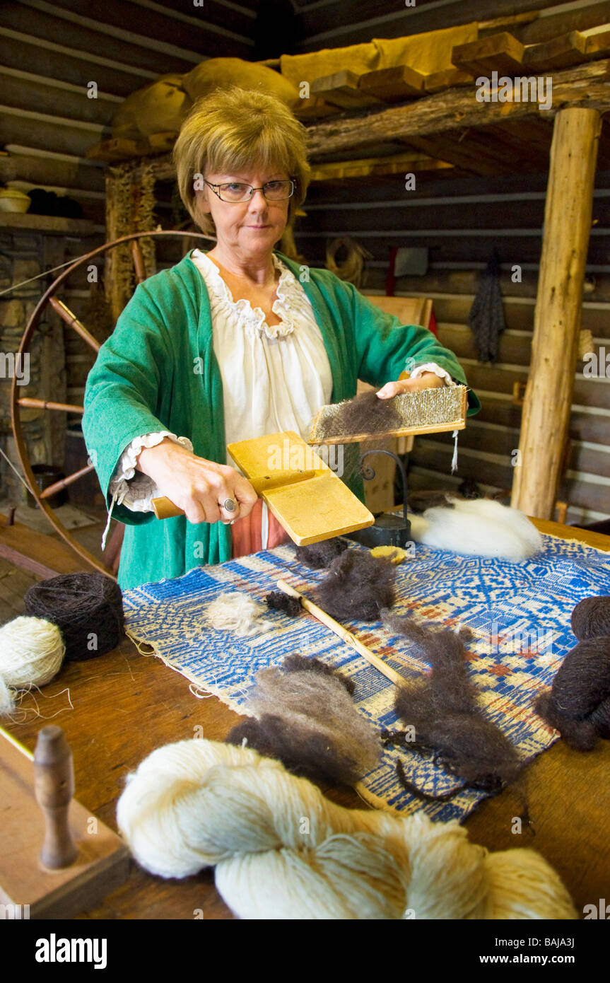 An artisan combing wool at the Fort Boonesborough State Park near Richmond, Kentucky Stock Photo