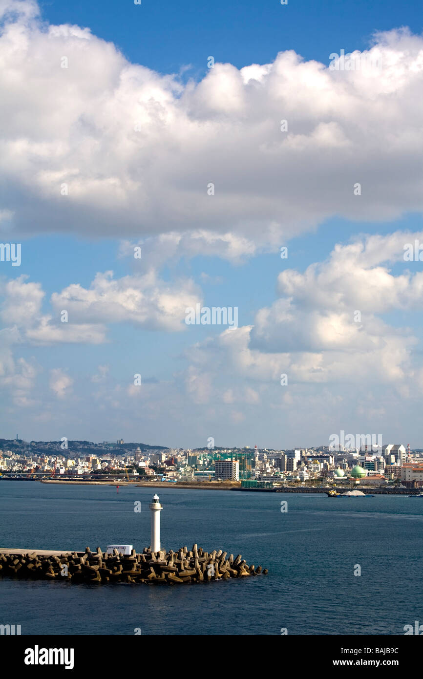 Breakwater Lighthouse, Naha, Okinawa Island, Japan; Lighthouse with city in the background Stock Photo