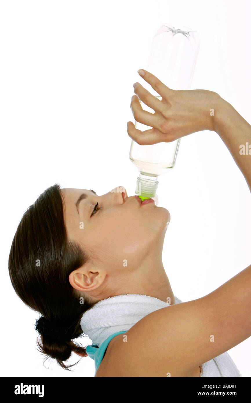 junge Frau in Sportdress mit Wasserflasche, woman drinking water Stock Photo