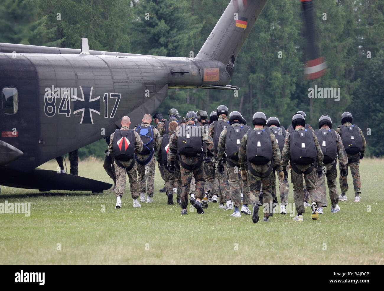 A unit of paratroopers boarding a helicopter Stock Photo