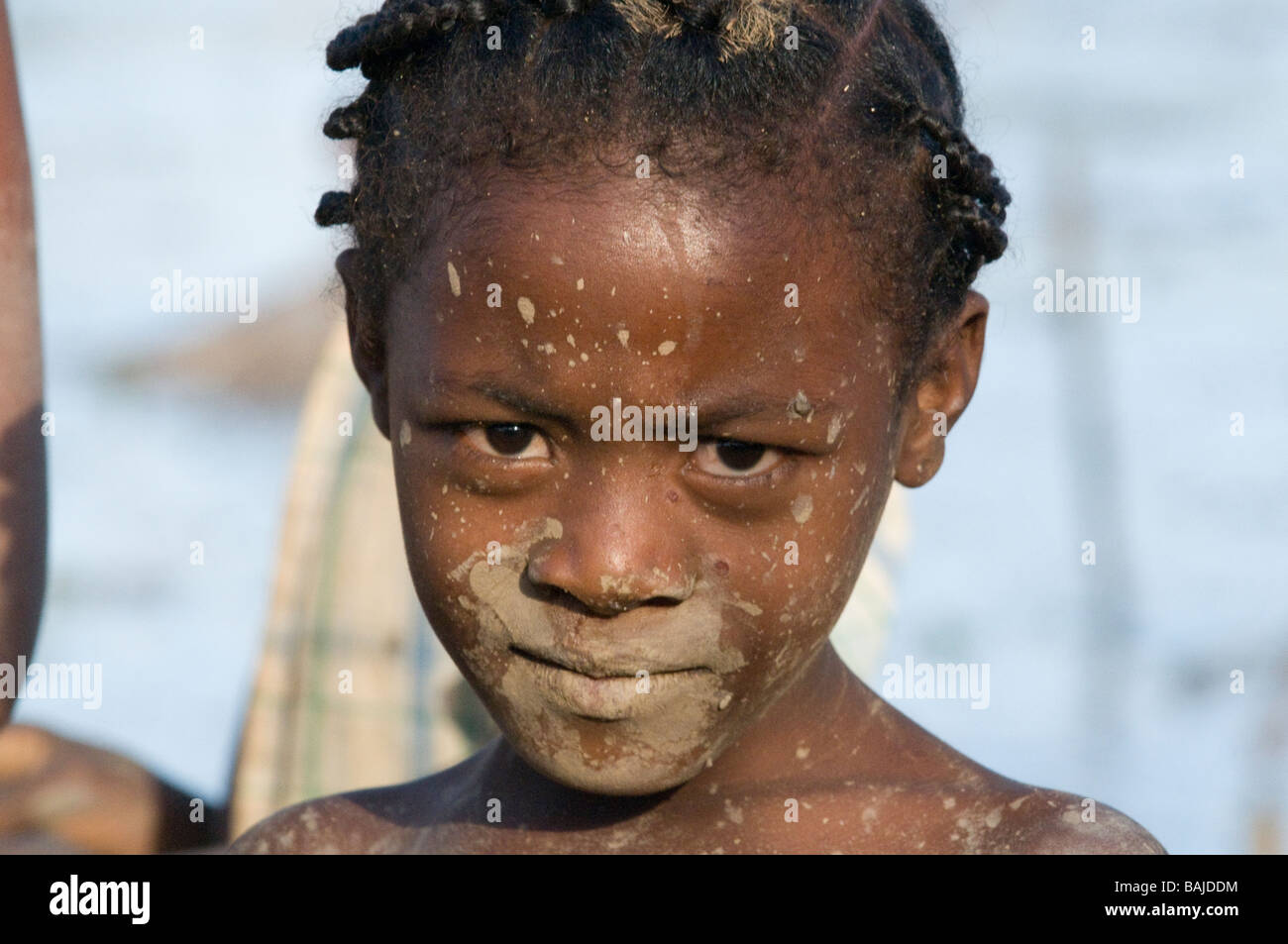 Portrait of a sceptical looking dirty girl Ankarana Madagascar Africa Stock Photo