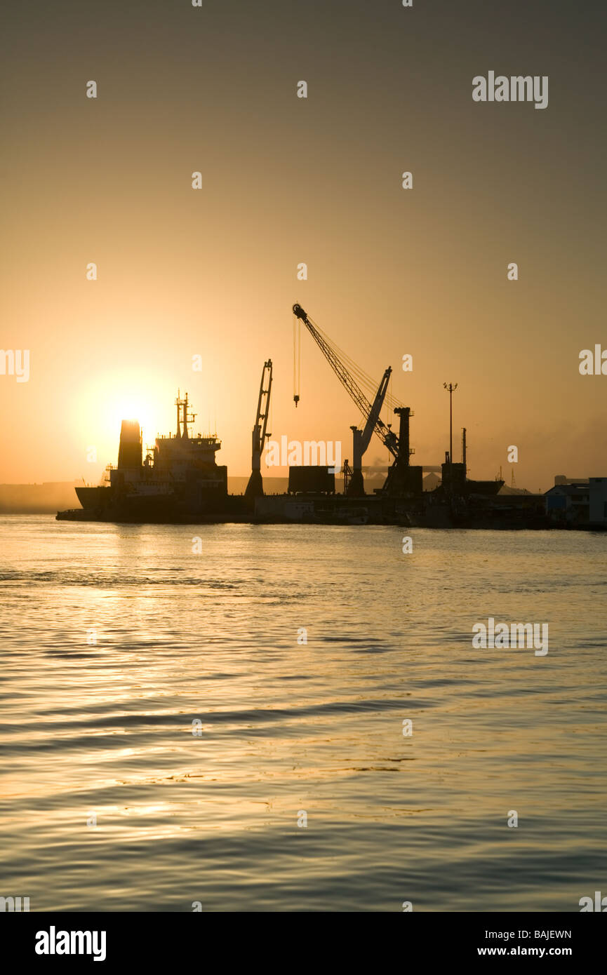 Cargo ship loading up at Sfax port in Tunisia Stock Photo