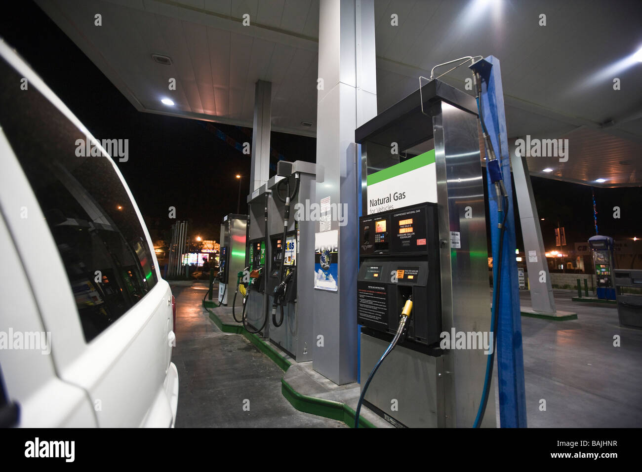 Close up of cat at gas station fuel pumps with natural gas at night Stock Photo Alamy