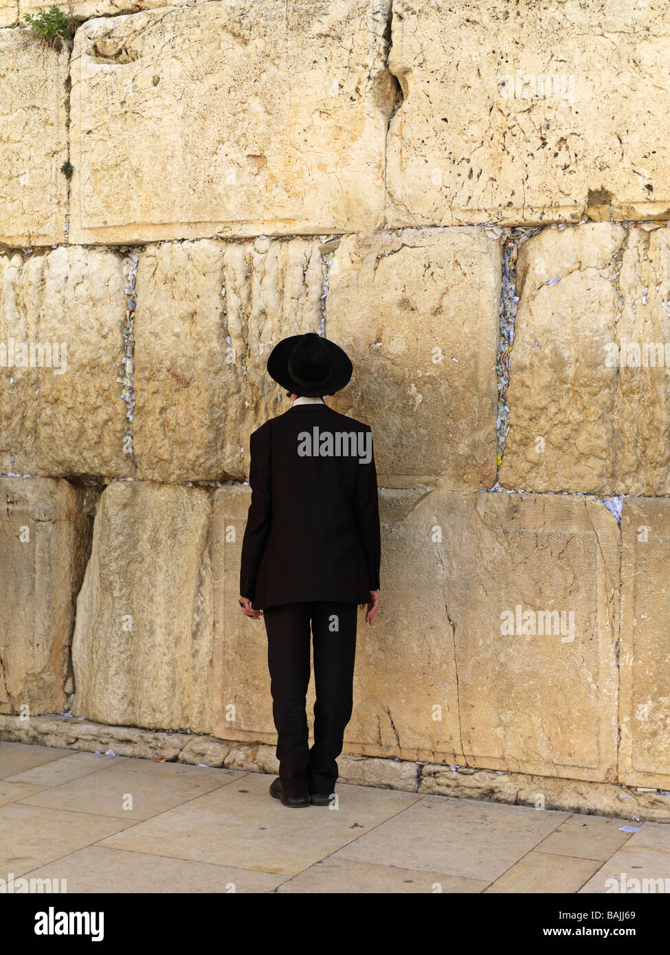Israel Jerusalem Western Wall or Wailing Wall with worshiper Stock Photo