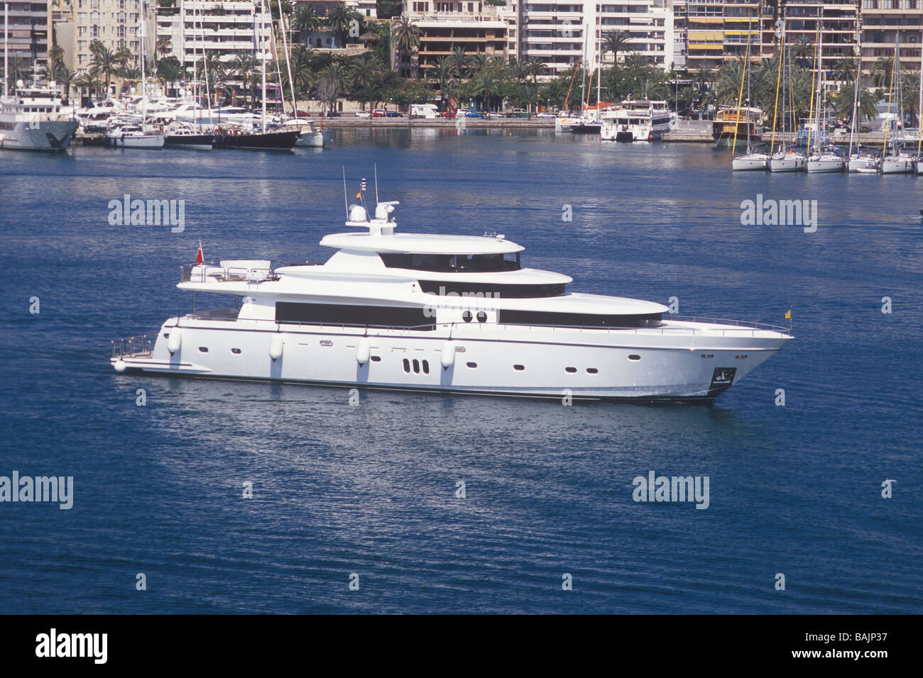 Luxury superyacht Johnson 105 ( 32 mtrs 'White Shark' )   passing Paseo Maritimo, Palma de Mallorca Stock Photo