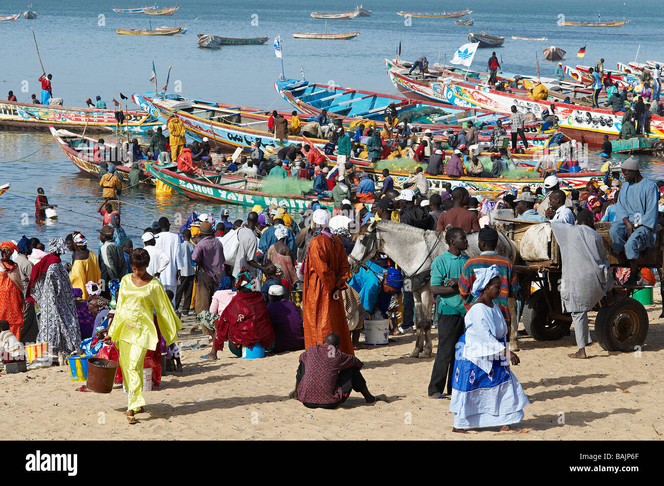 Senegal, Thies Region, the Petite Cote, Mbour fishing harbour, crowd in the beach Stock Photo