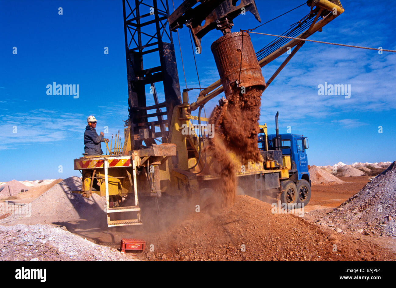 A blower - mining equipment in action on Coober Pedy's opal fields ...