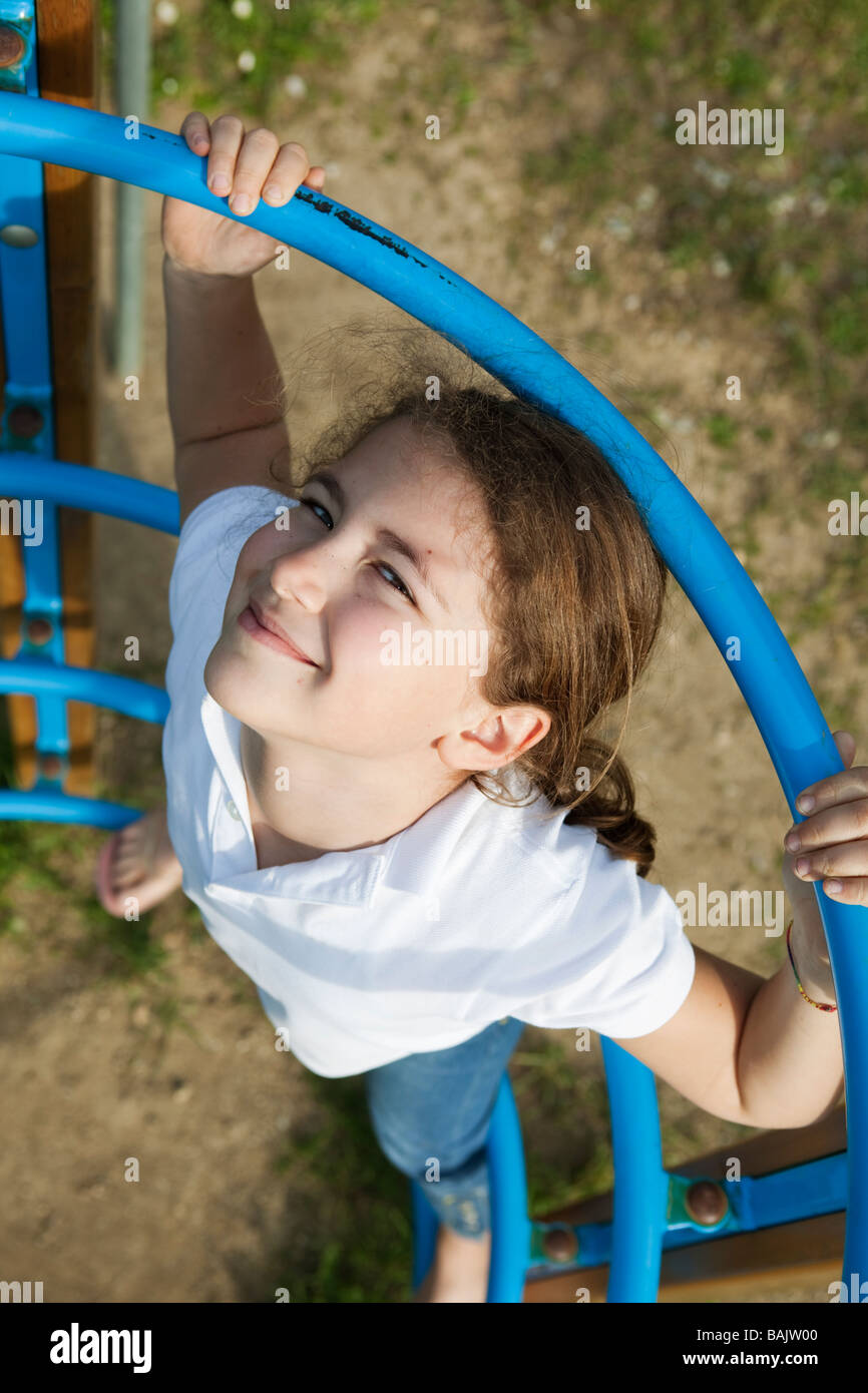 Young girl smiling at the playground Stock Photo - Alamy
