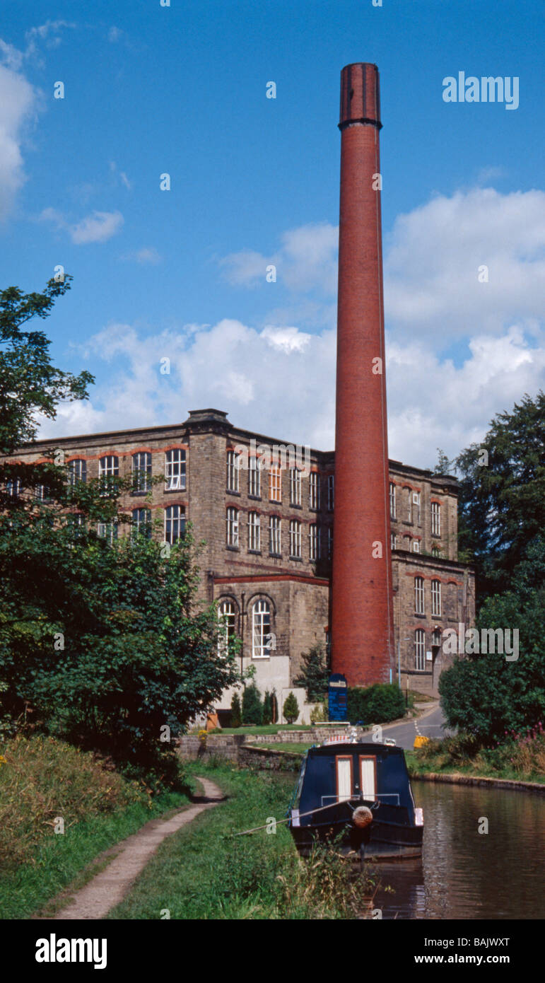 Clarence Mill with chimney, by Macclesfield Canal, Bollington, Cheshire, England, UK Stock Photo