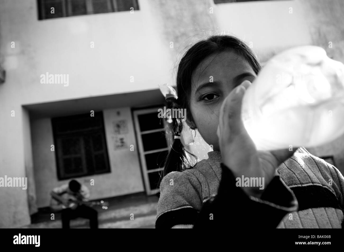 girl drinking from a water bottle Stock Photo