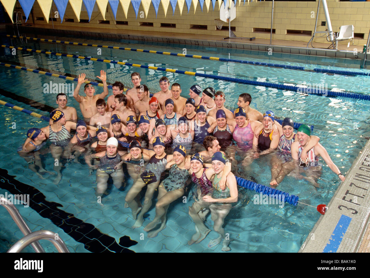 Group Portrait Of Teenage Boys And Girls On A High School Swim Team In The Swimming Pool Stock Photo Alamy