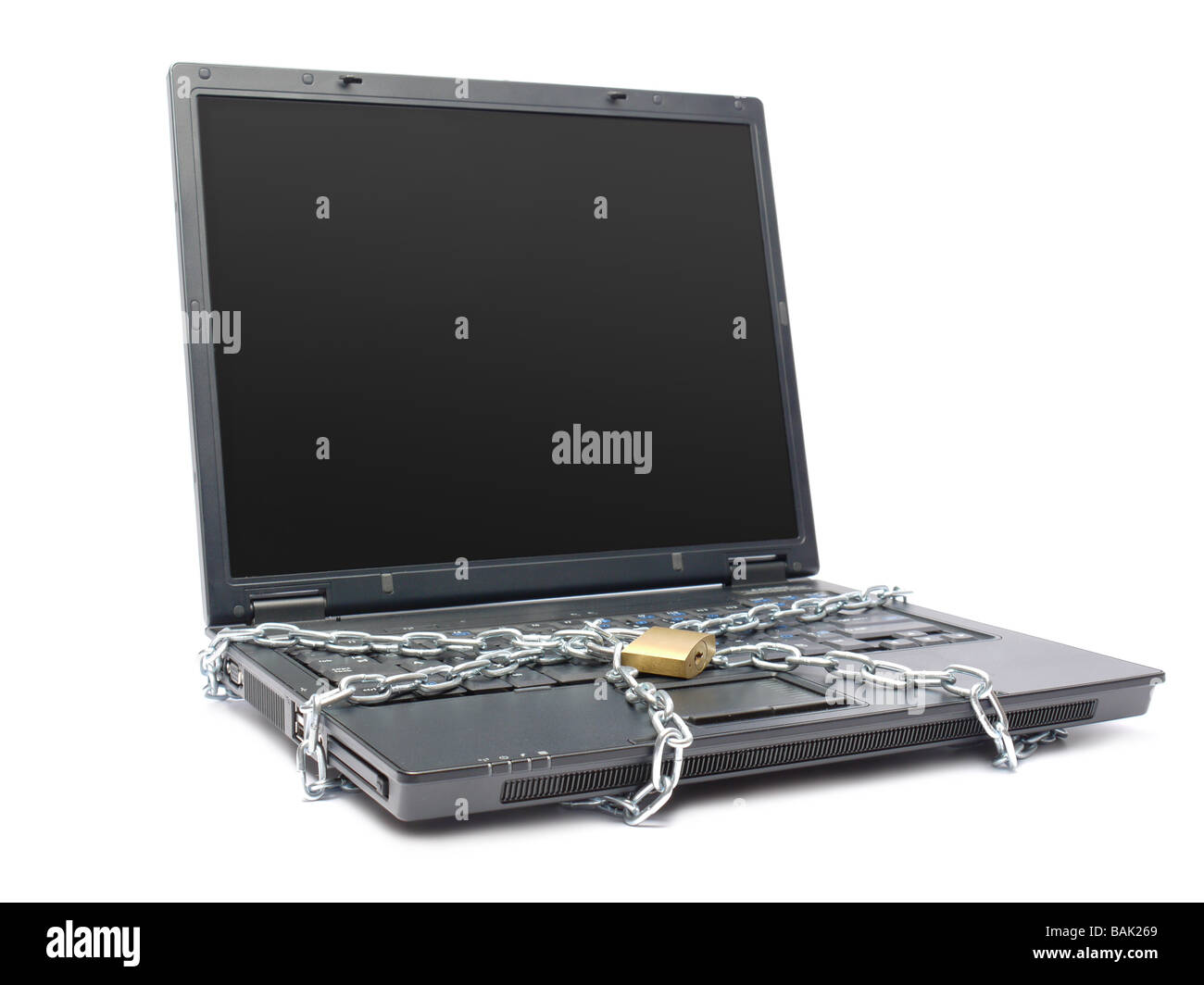 Laptop keyboard wrapped around with metal chain and locked with padlock shot over white Stock Photo