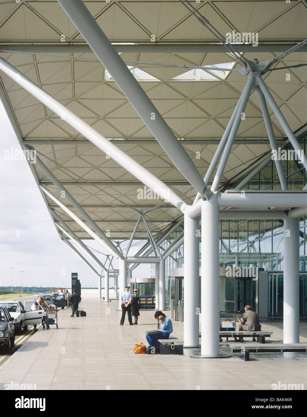 stansted airport exterior drop off point, with people, portrait format Stock Photo
