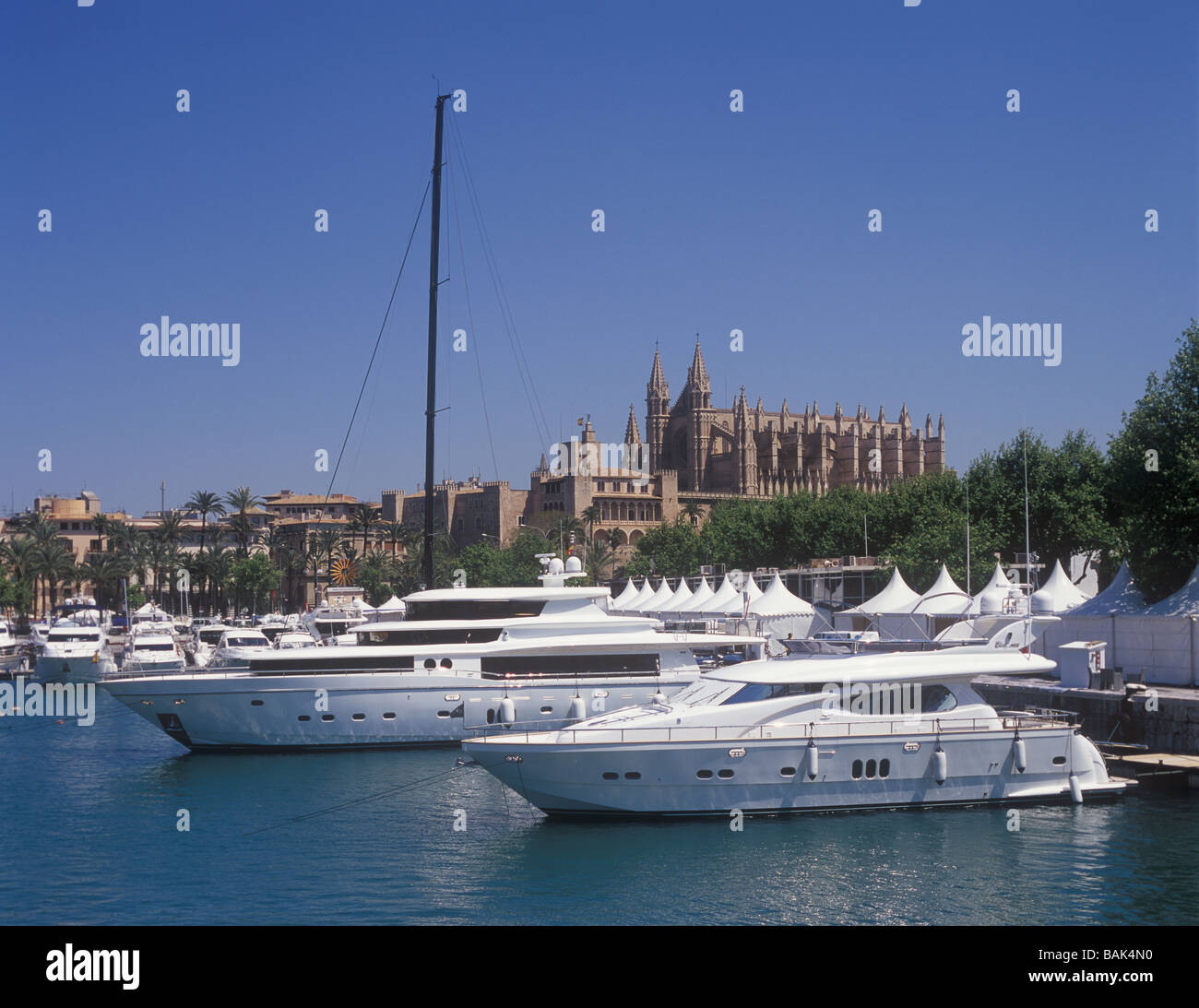Palma International Boat Show 2009, during assembly of boats on display, with historic Palma Cathedral behind, Stock Photo