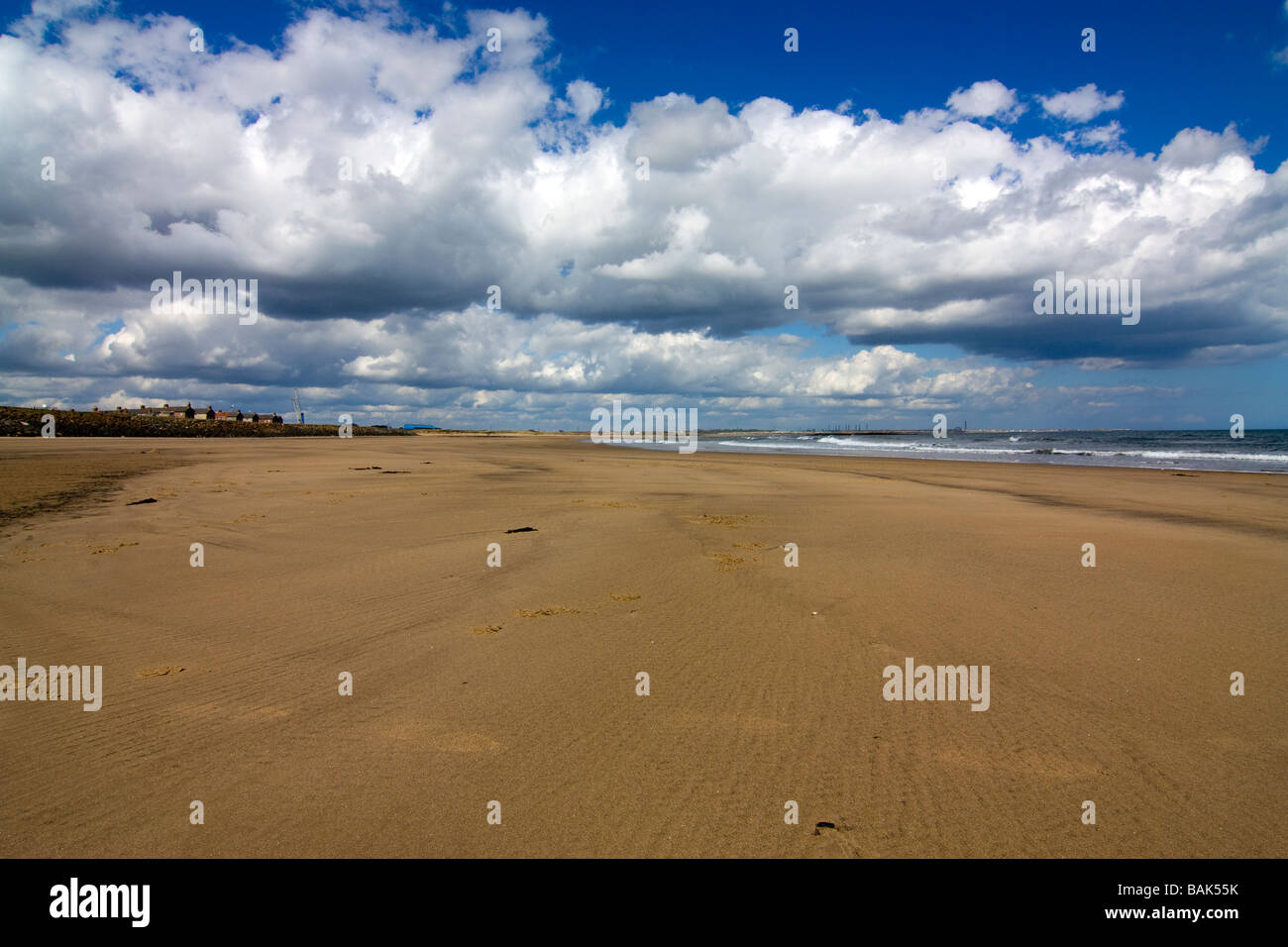 Cambois beach North of Blyth Northumberland showing small offshore wind turbine farm Stock Photo