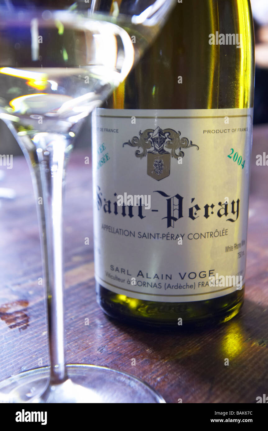 glass and bottle st peray 2004 in cellar dom a voge cornas rhone france Stock Photo