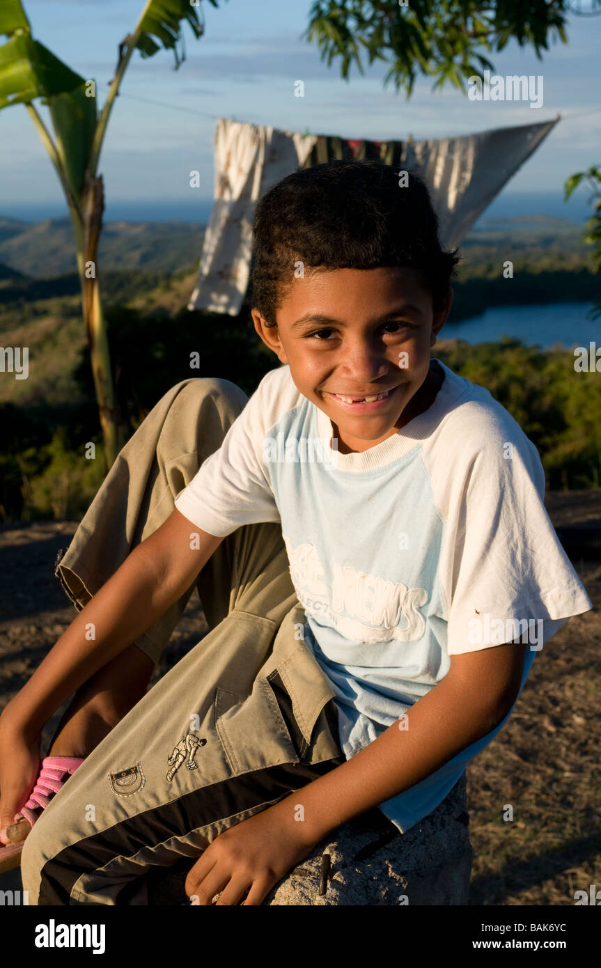 Dark skinned grinning boy Nosy Be Madagascar Africa Stock Photo