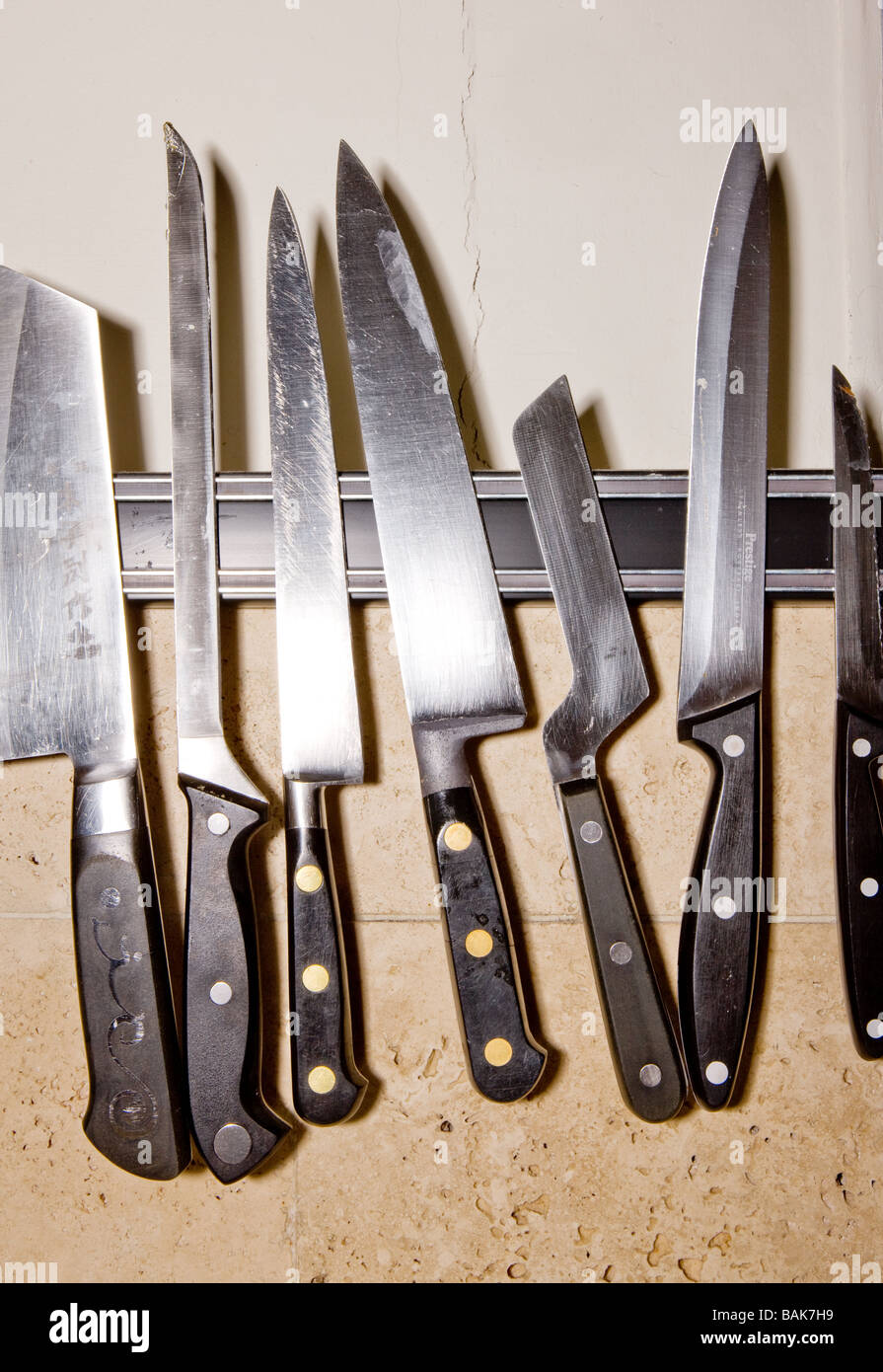 A rack of knives in a kitchen Stock Photo