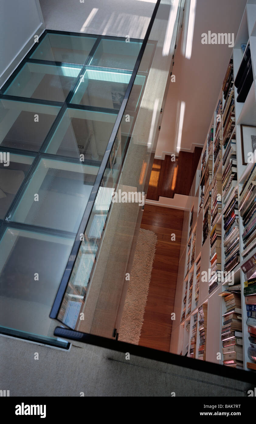 queens park house glass floor, atrium, bookcase Stock Photo Alamy