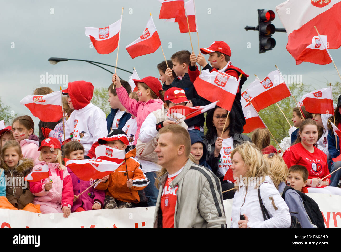Kids on a flaot waving flags in Chicago Polish Parade Stock Photo Alamy