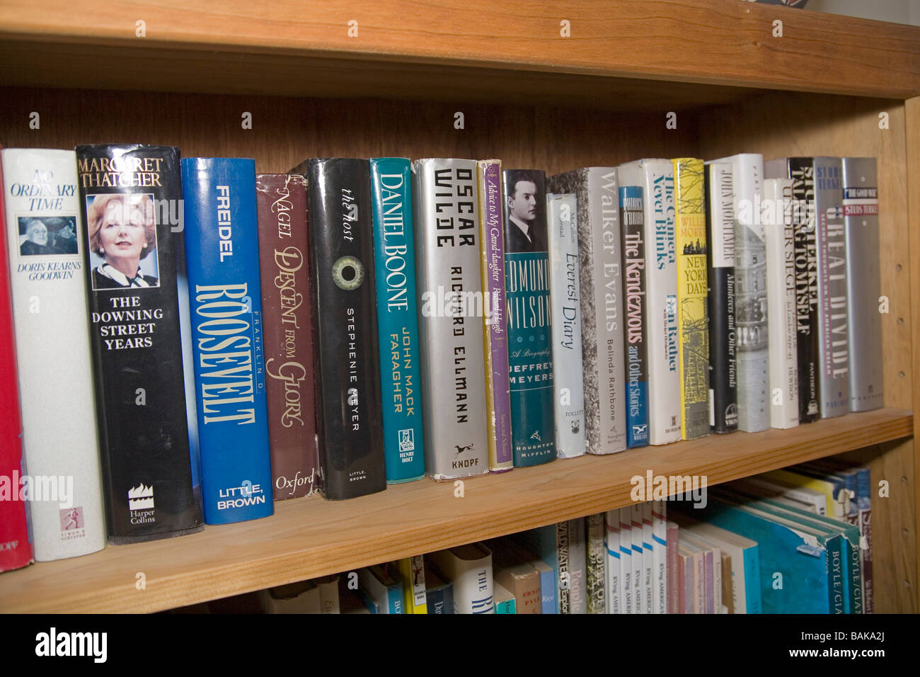 Hardback books on a home library shelf Stock Photo