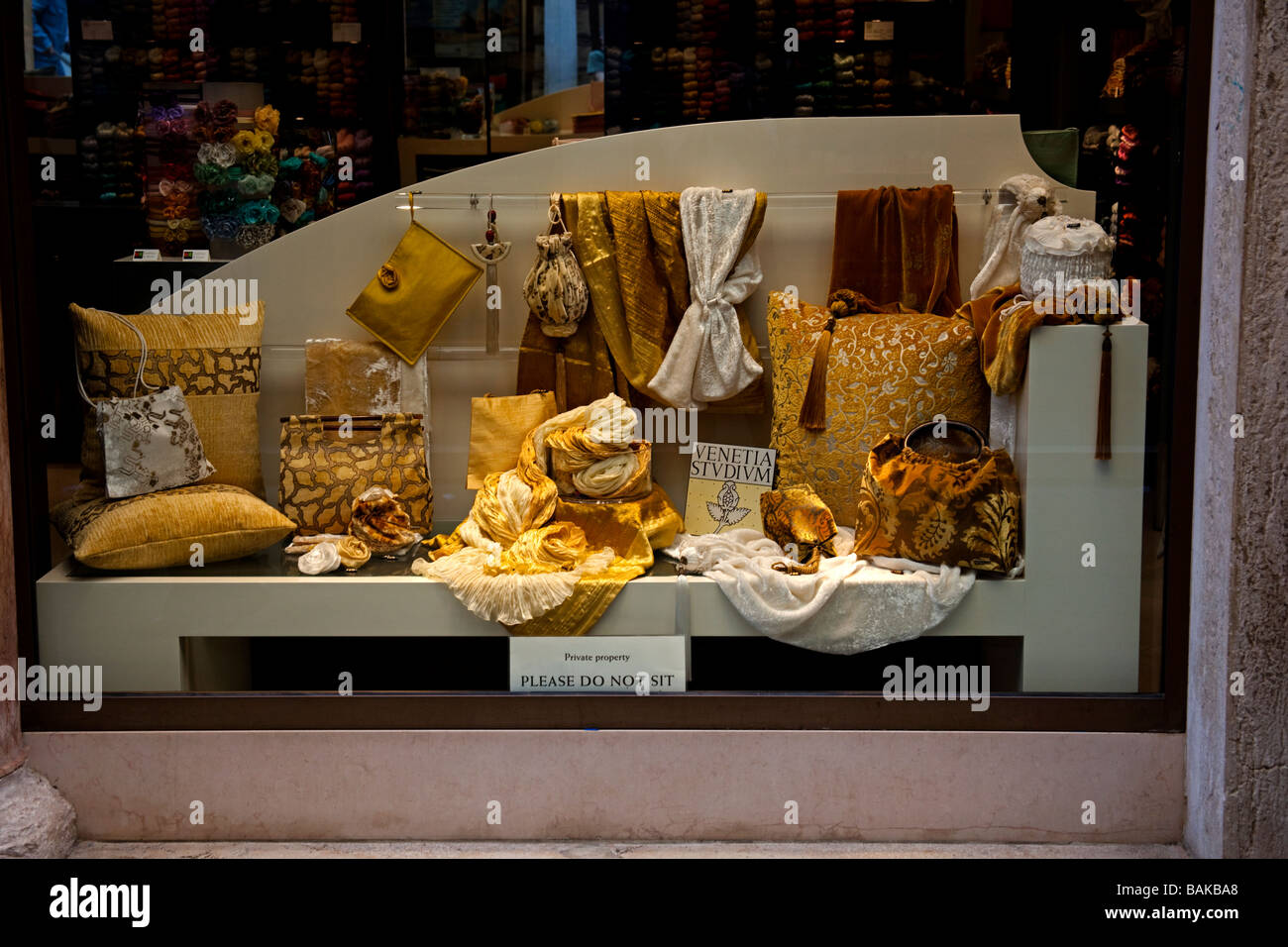 Shop window colourful fabrics material Venice Italy Stock Photo