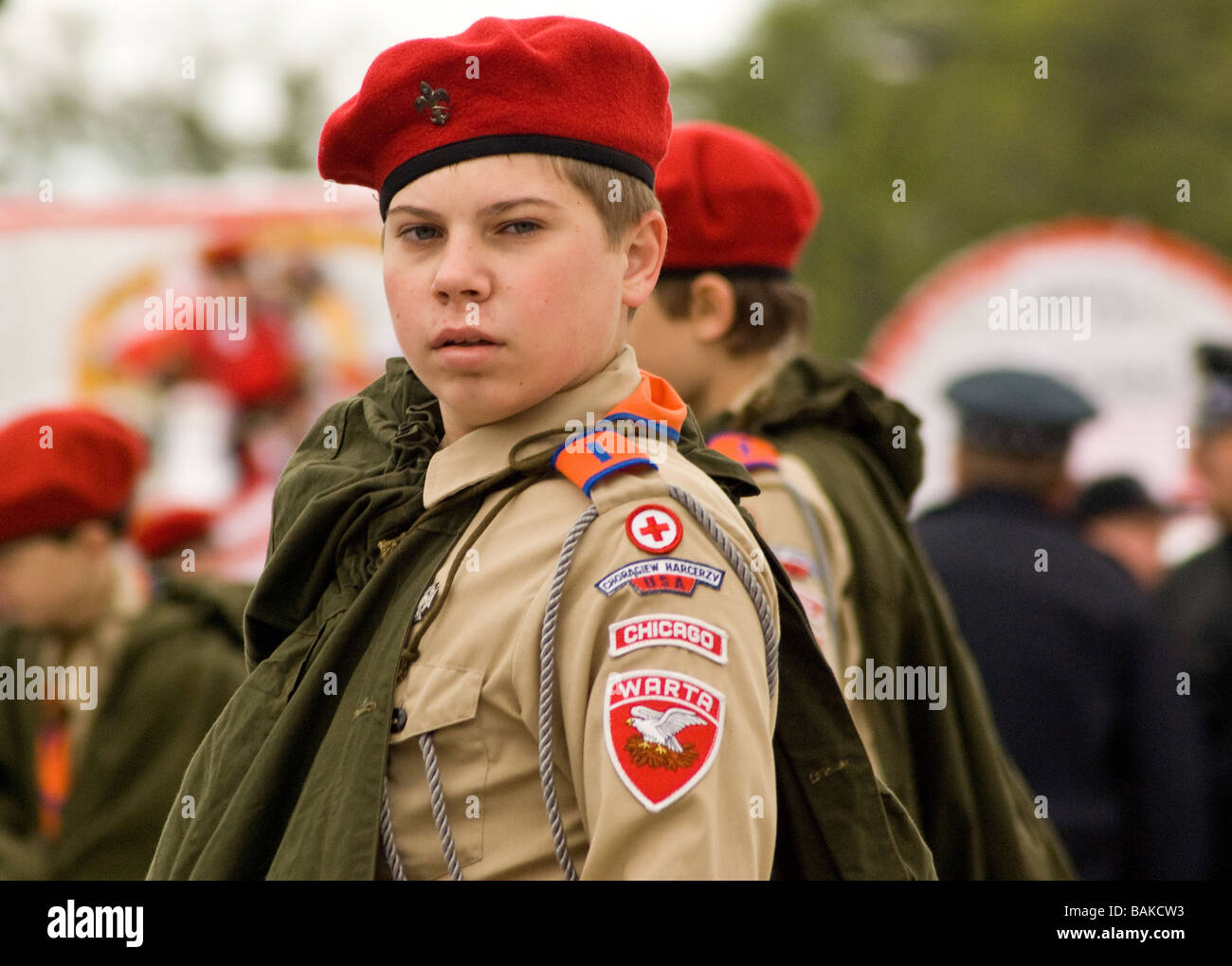 Boy in scout uniform and beret marching in Chicago Polish Parade Stock Photo